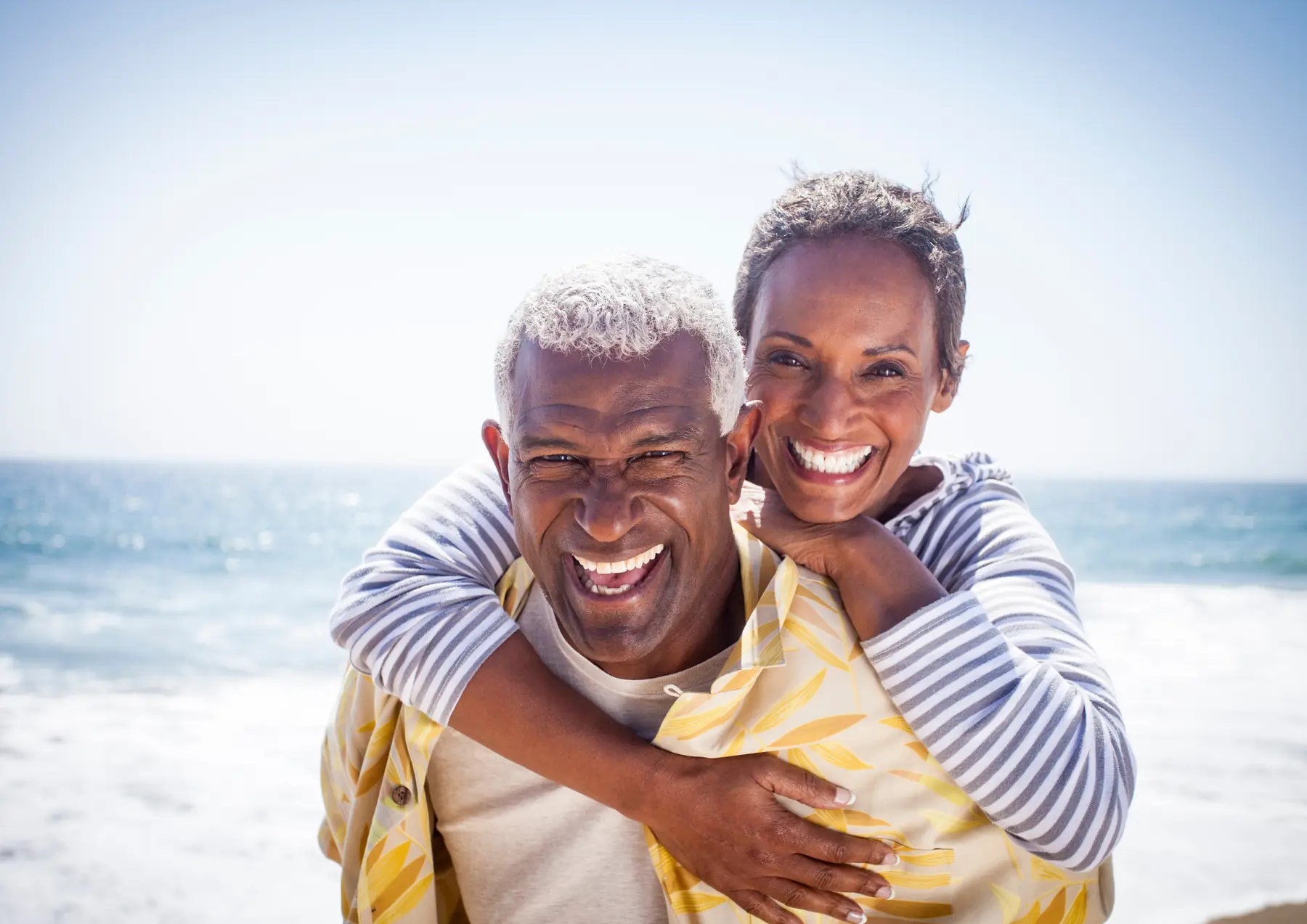 Couple laughing together at the beach